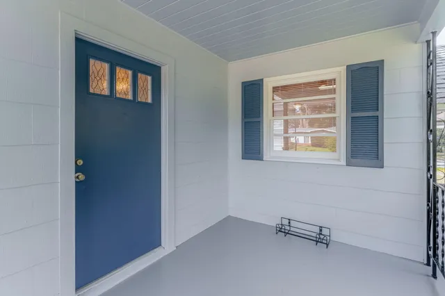 a view of an empty room with windows