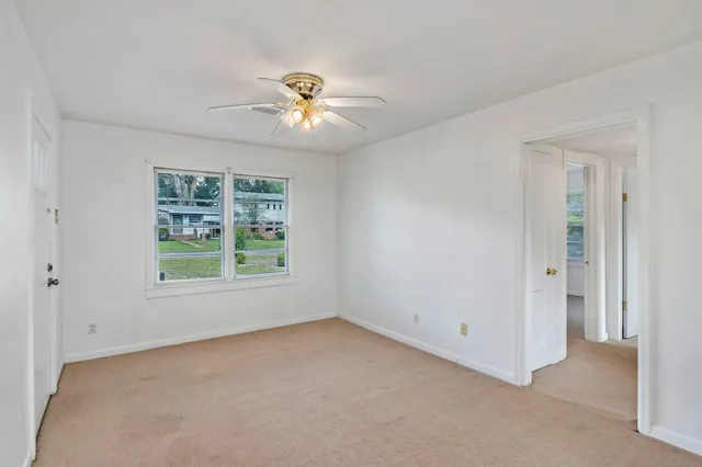 a view of an empty room with a window