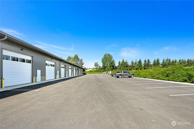 a view of a house with a street from a balcony