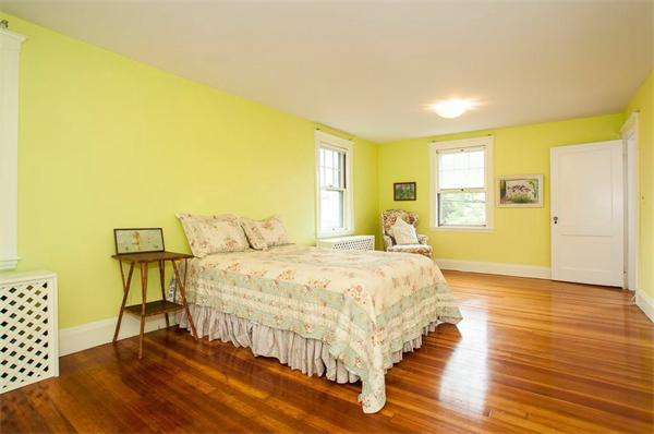 58 Governors Road Milton, MA 02186 - Photo 20 of 30 a bed sitting in a spacious bedroom next to a window