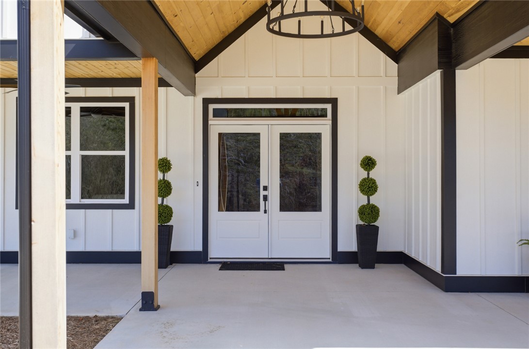 147 McAlister Road West Union, SC 29696 - Photo 3 of 49 This inviting entrance features clean lines and a charming covered porch, perfect for welcoming guests.