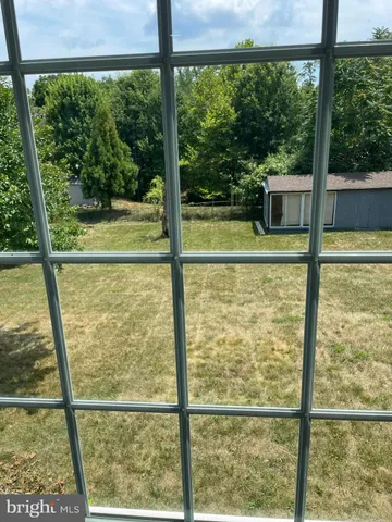a view of a glass door with a swimming pool