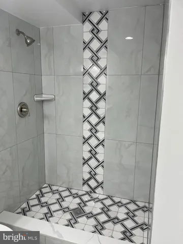 a bathroom with a sink and a shower