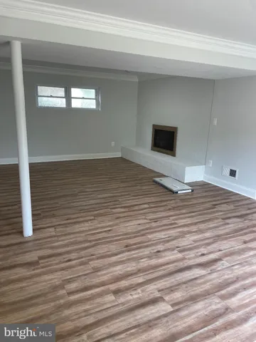 a view of a livingroom with wooden floor