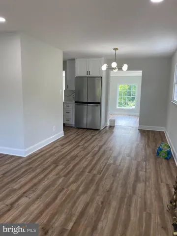 a view of a kitchen with a sink and a microwave