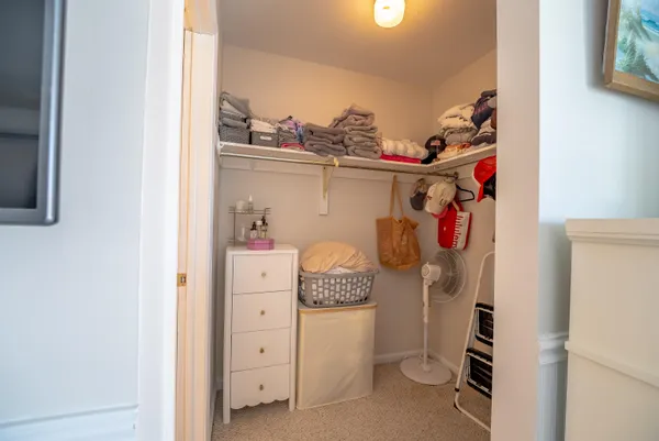 a bedroom with a bed and a flat tv screen