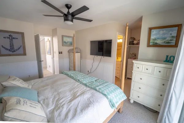 a bedroom with a bed and furniture
