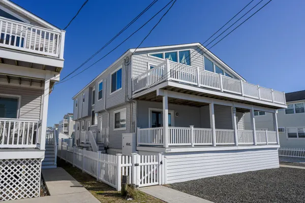 a front view of a house with a small yard