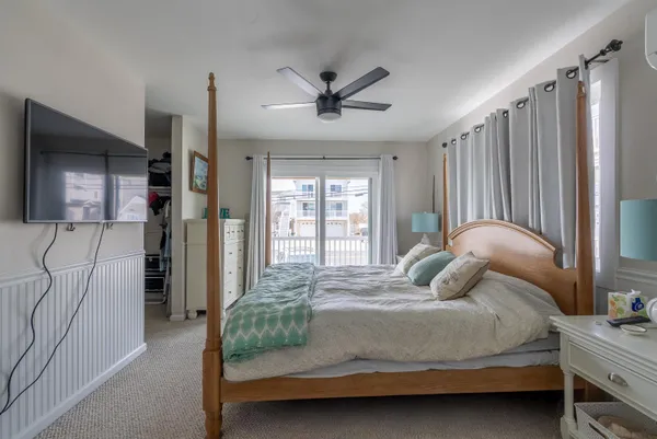 a bedroom with a bed window and a walk in closet