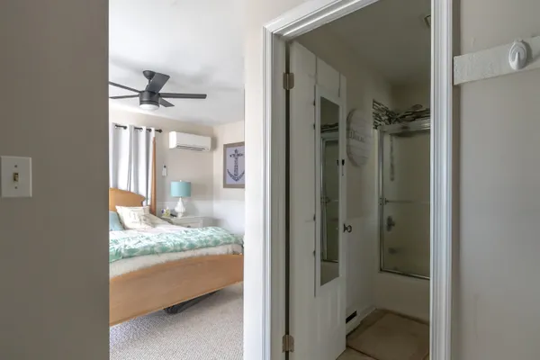 a bathroom with a granite countertop sink a mirror and a shower