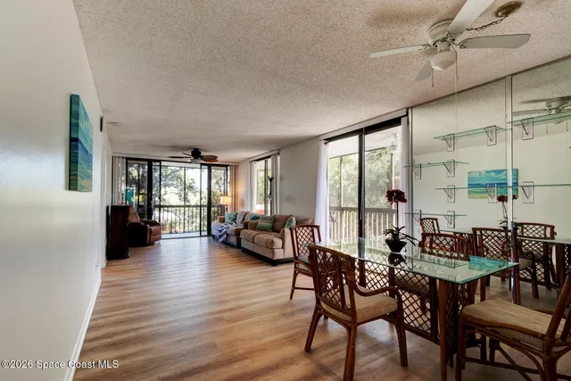 a view of a dining room with furniture and window
