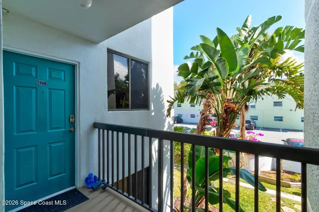 a view of a balcony with plants
