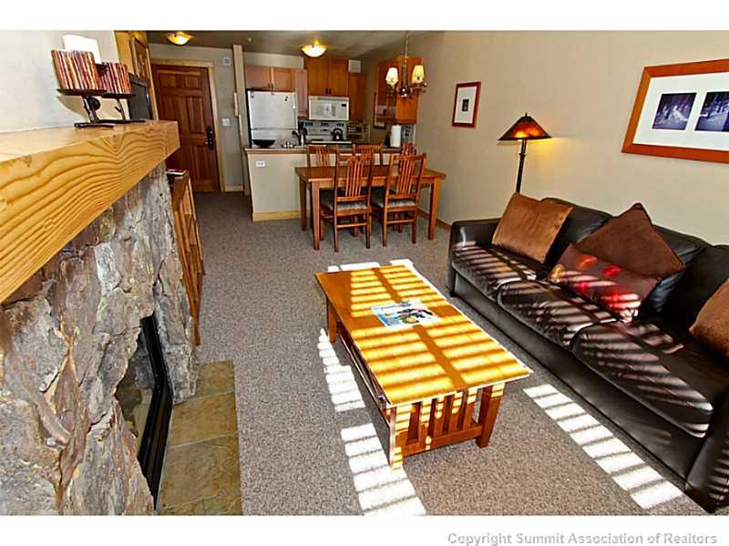 910 Copper Road, Unit 407 Copper Mountain, CO 80443 - Photo 13 of 21 a living room with furniture and wooden floor