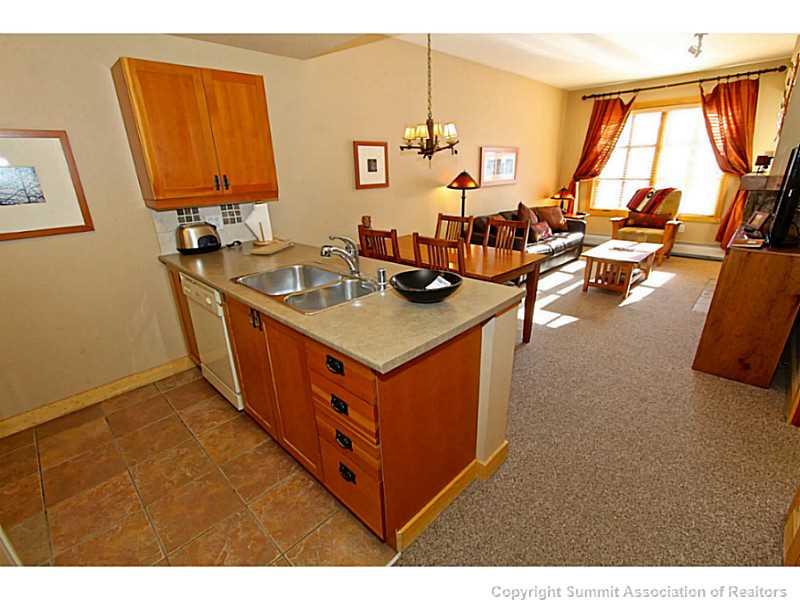 910 Copper Road, Unit 407 Copper Mountain, CO 80443 - Photo 3 of 21 a kitchen with stainless steel appliances granite countertop a stove and a sink