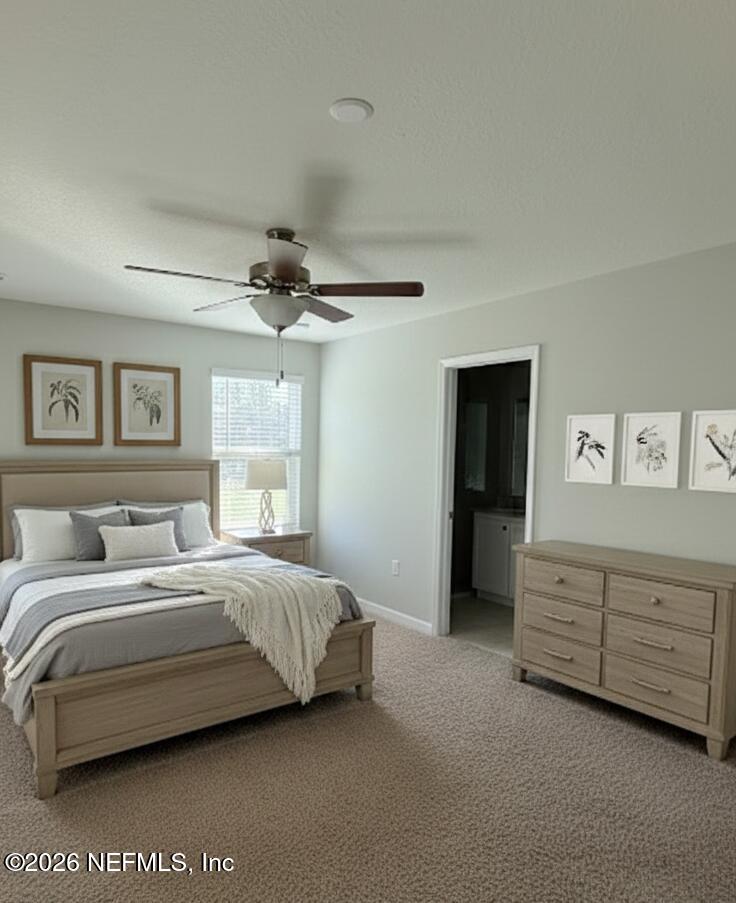 1070 Cahoon Road South Jacksonville, FL 32221 - Photo 6 of 8 a bedroom with a bed and a chandelier