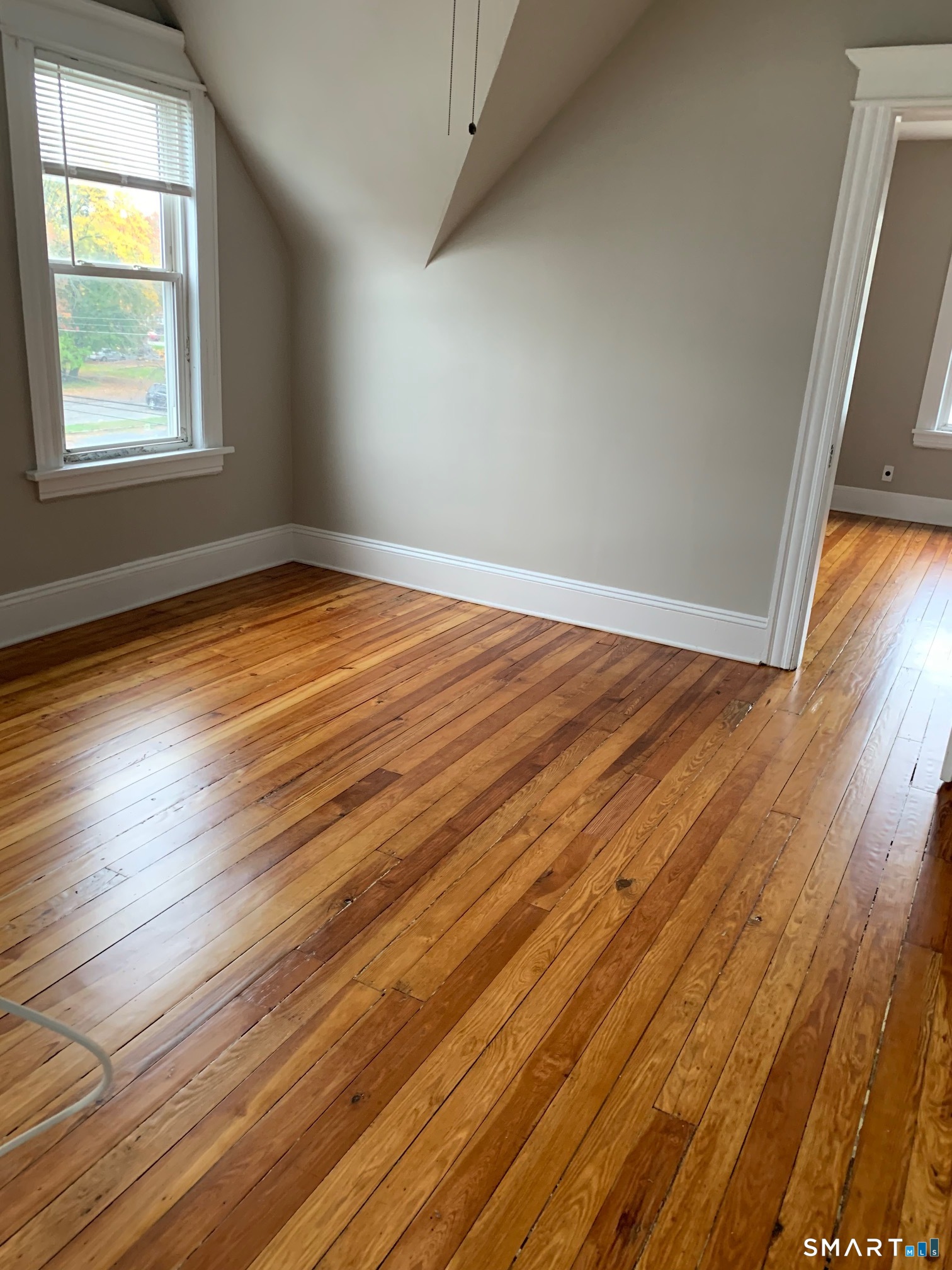 885 Grand Street Bridgeport, CT 06604 - Photo 36 of 40 an empty room with wooden floor and windows