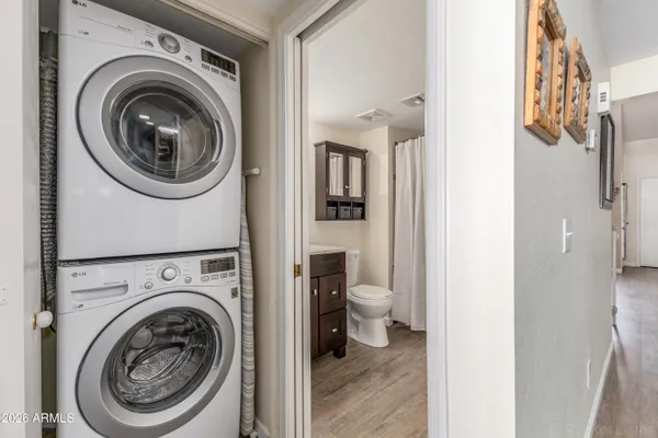 a view of a hallway with washer and dryer