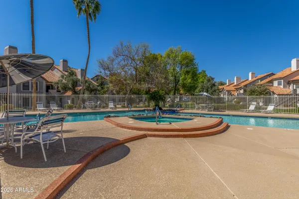 a view of a swimming pool with a yard