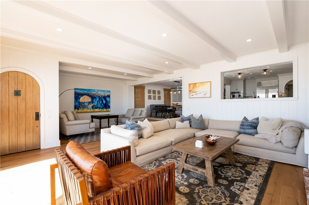 1228 West Oceanfront Newport Beach, CA 92661 - Photo 12 of 32 a living room with furniture and a wooden floor