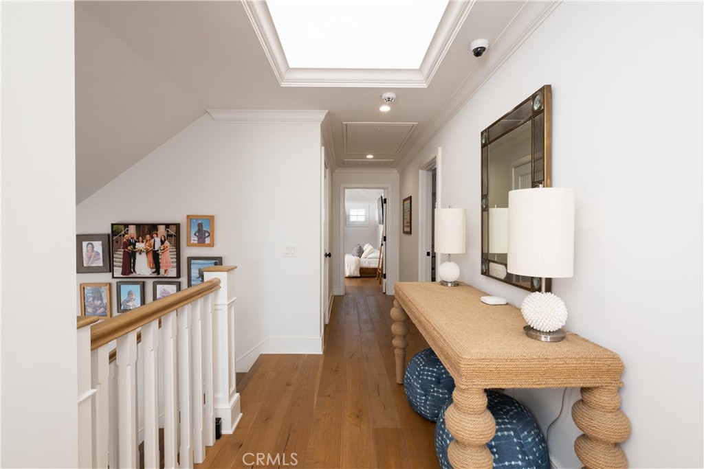 1228 West Oceanfront Newport Beach, CA 92661 - Photo 23 of 32 a view of a hallway with furniture and stairs
