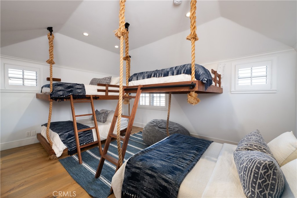 1228 West Oceanfront Newport Beach, CA 92661 - Photo 26 of 32 a bedroom with furniture and a wooden floor