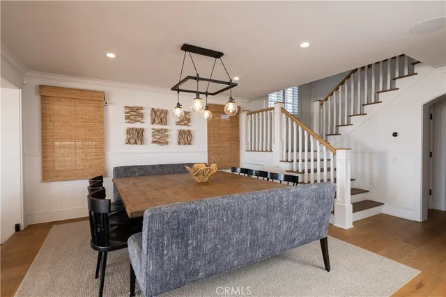 a bedroom with furniture and wooden floor