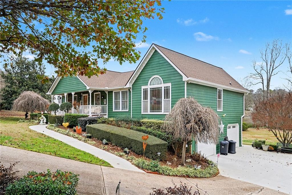 a front view of a house with garden