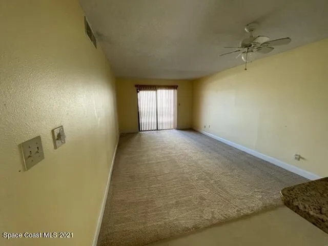 a view of a hallway with a window