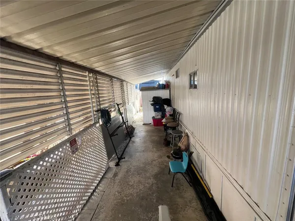 a view of a hallway with seating space