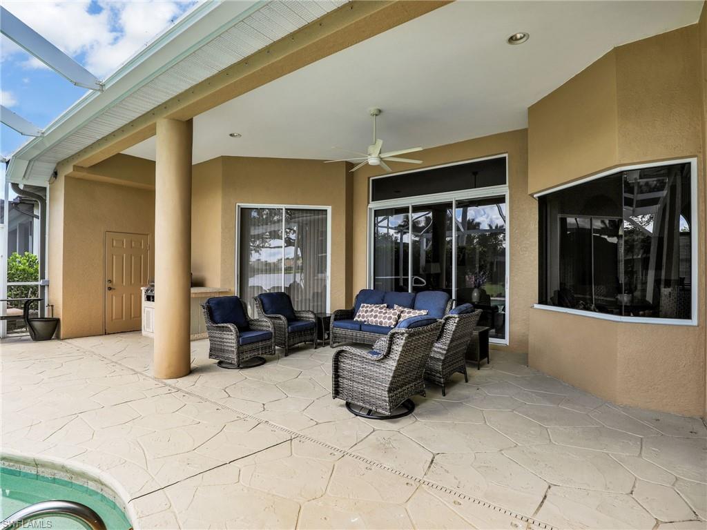 8845 Lely Island Circle Naples, FL 34113 - Photo 13 of 45 a living room with furniture large window and furniture
