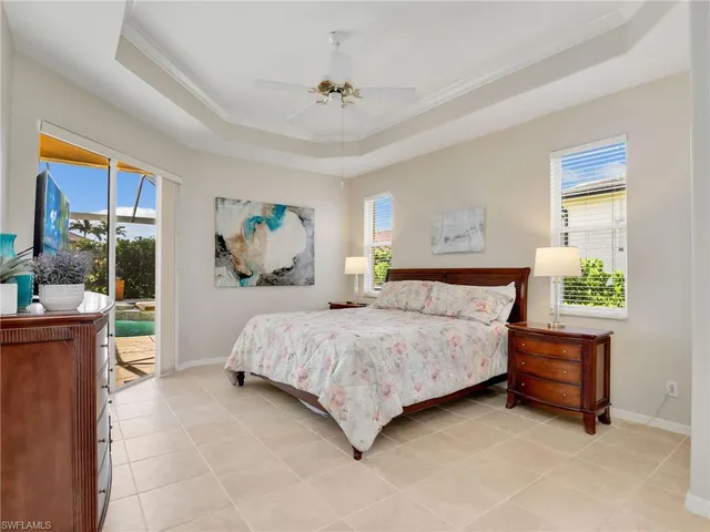 a bedroom with a bed and a flat screen tv in it