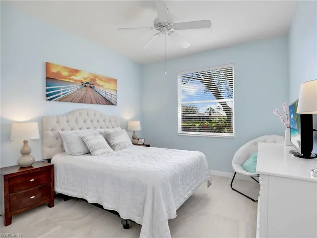 a view of a bedroom with wooden floor