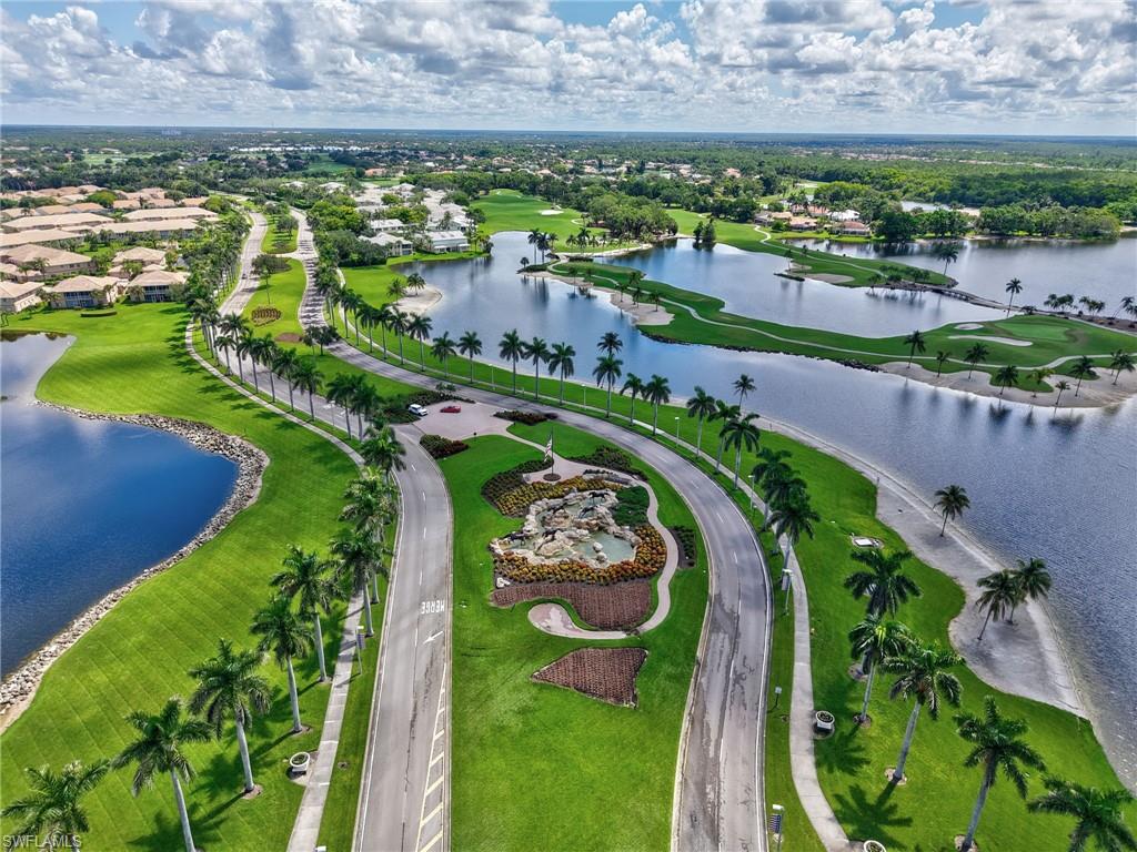 8845 Lely Island Circle Naples, FL 34113 - Photo 42 of 45 an aerial view of a house with a garden and lake view