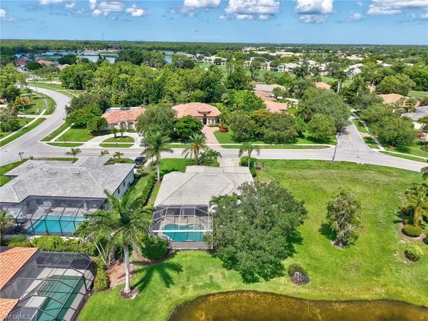 an aerial view of a house with a yard