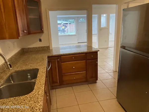a bathroom with a bathtub sink and mirror