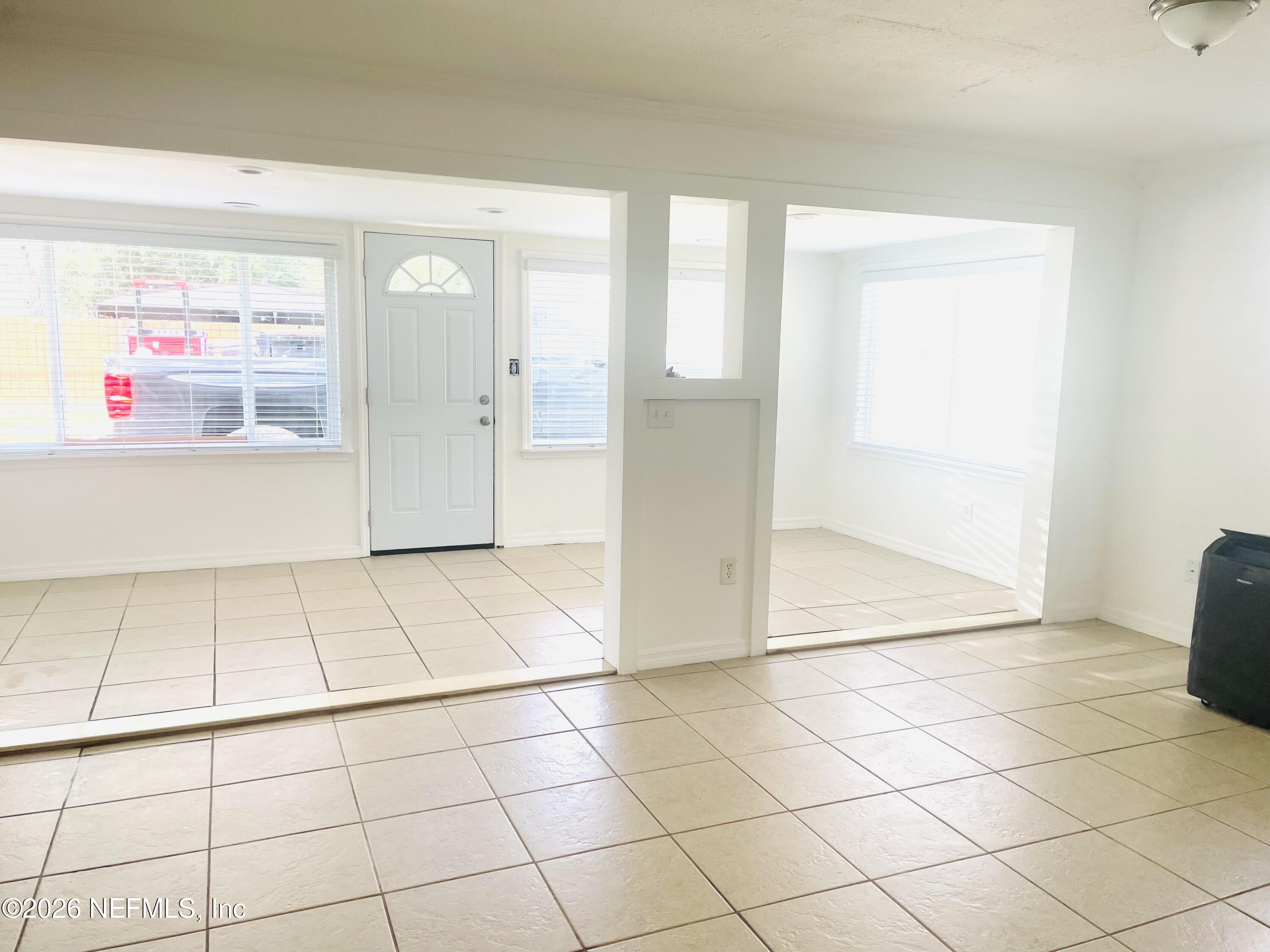1815 5th Street St. Cloud, FL 34769 - Photo 5 of 9 a view of a livingroom with an empty space and a window