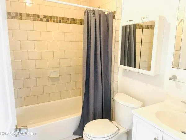 a bathroom with a toilet and a bathtub