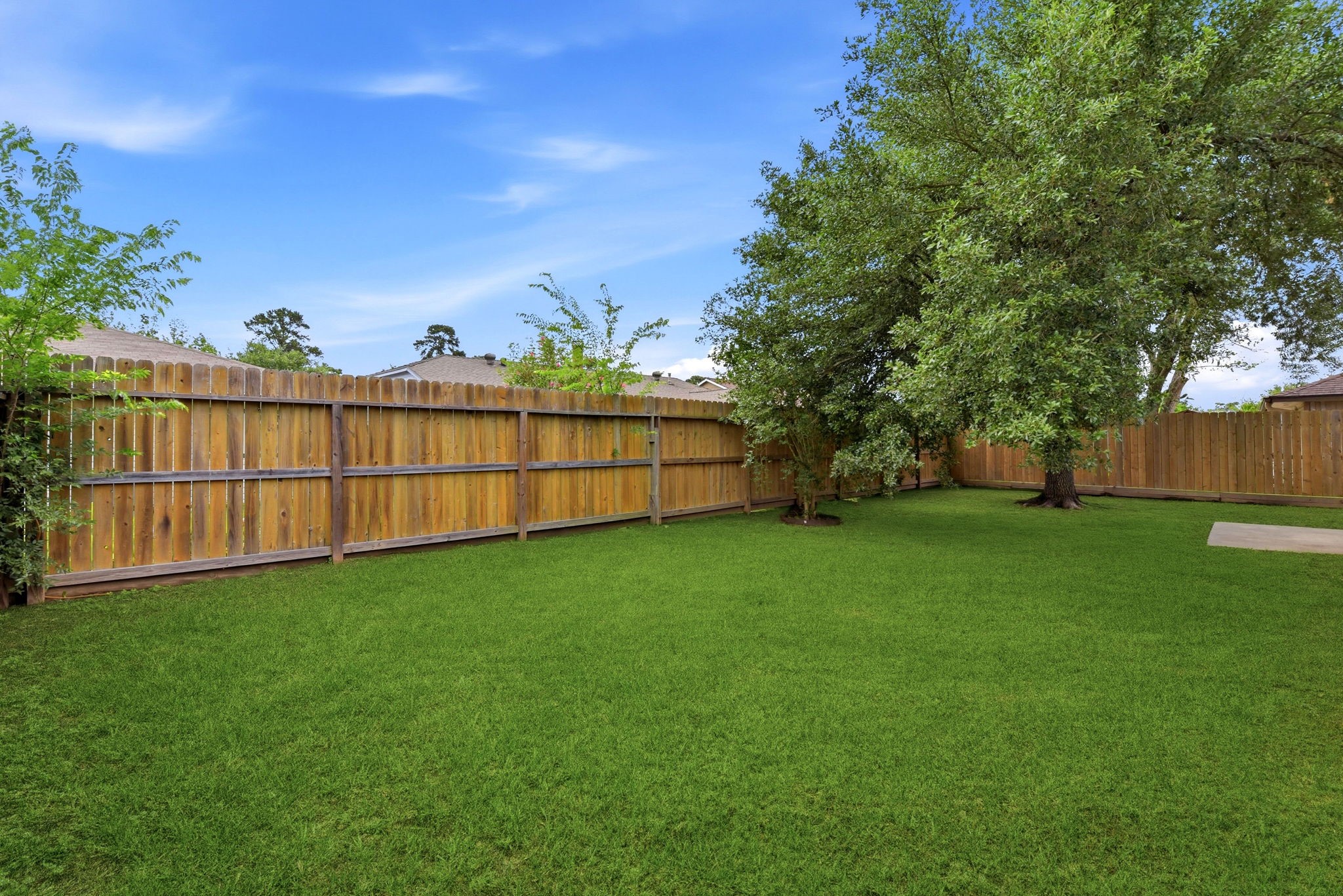 21330 Golden Dove Drive Spring, TX 77388 - Photo 28 of 29 A tall wooden privacy fence fully encloses the space, ensuring total peace and quiet.