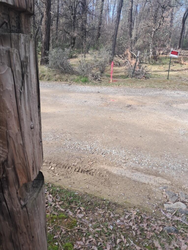 3082-3060 Keswick Dam Road Redding, CA 96003 - Photo 20 of 25 a backyard of a house with a tree