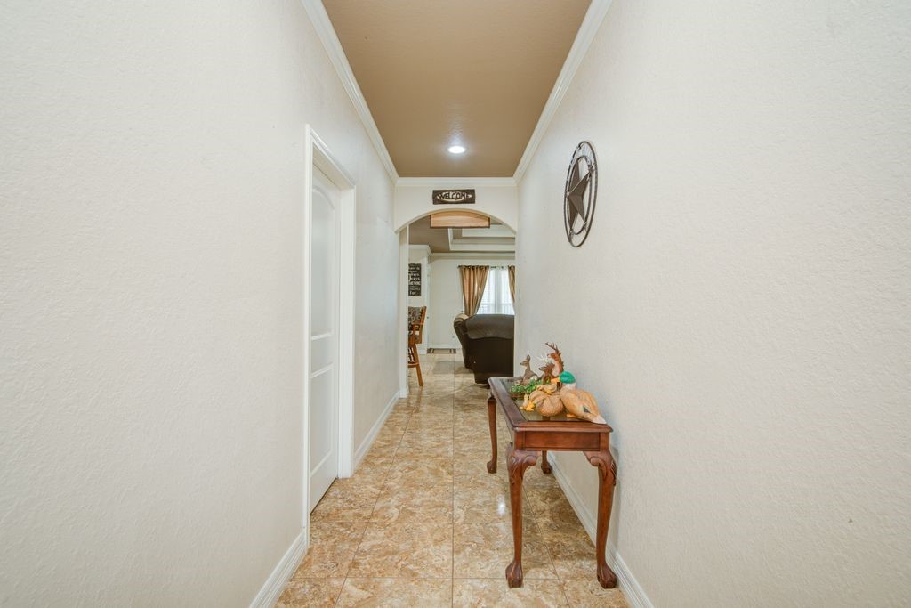 24910 Farm To Market 2004 Angleton, TX 77515 - Photo 6 of 50 a hallway with table and chairs