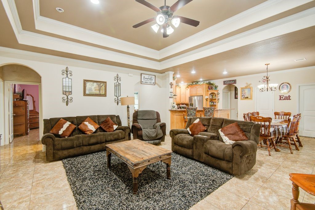 24910 Farm To Market 2004 Angleton, TX 77515 - Photo 7 of 50 a living room with furniture potted plant and a chandelier