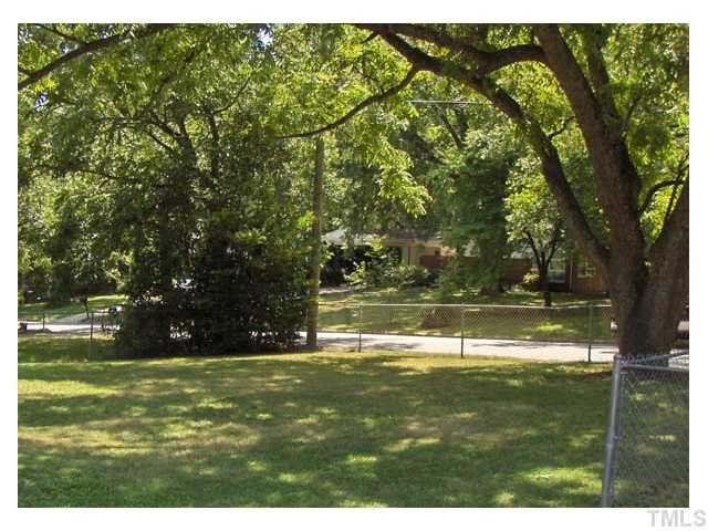 507 Ashford Street Raleigh, NC 27610 - Photo 12 of 14 The nice shady, fenced front yard will make a great play area for kids or a comfortable area to entertain. Exterior Front