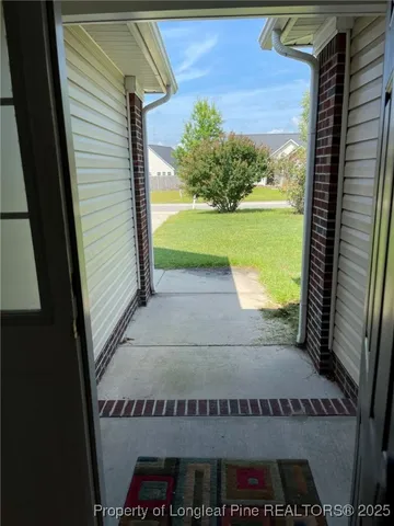 a view of a back yard from a balcony