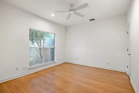 an empty room with a empty space and windows