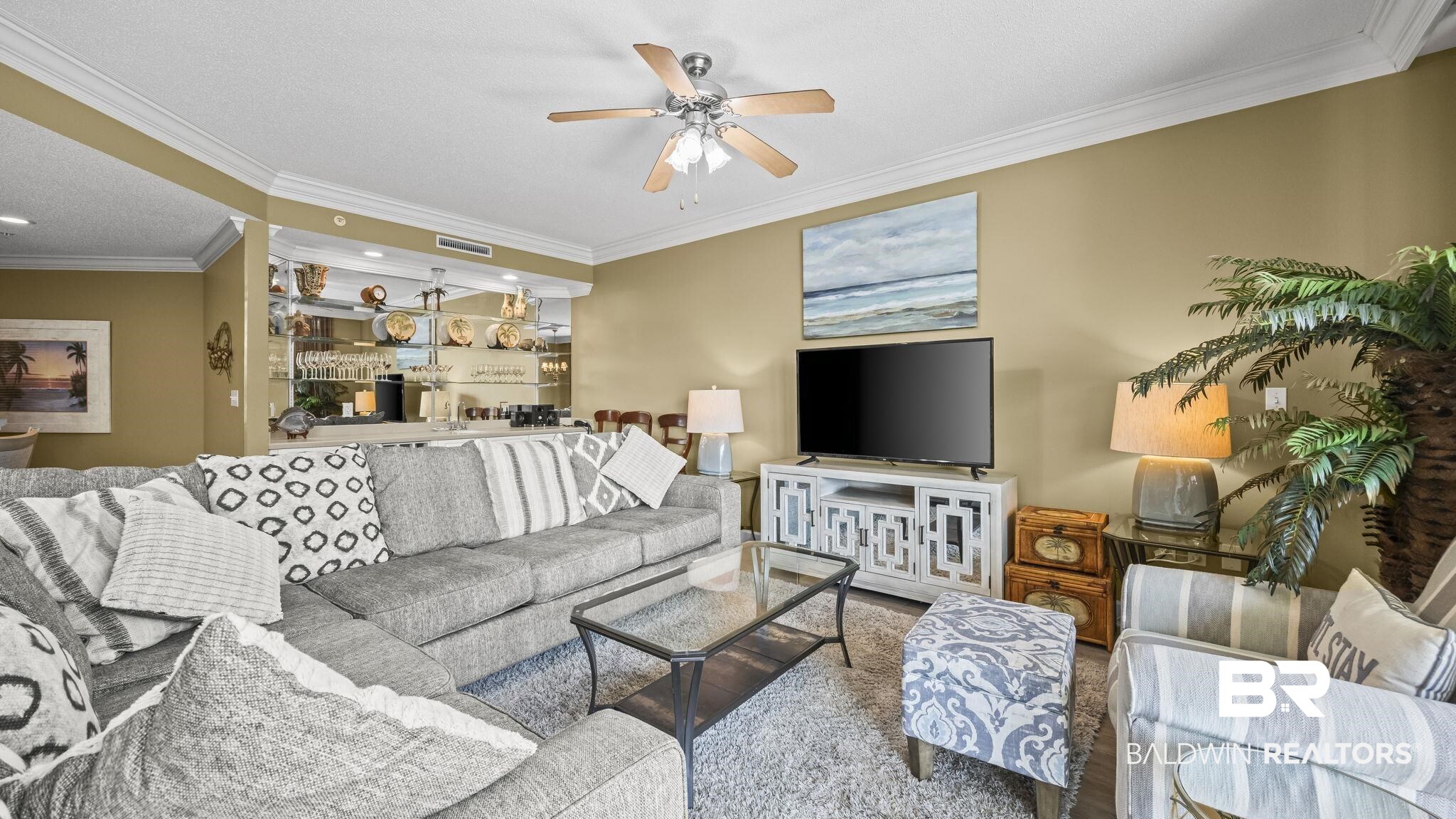 27580 Canal Road, Unit 214 BS 62 Orange Beach, AL 36561 - Photo 3 of 23 Living area featuring ornamental molding and a ceiling fan