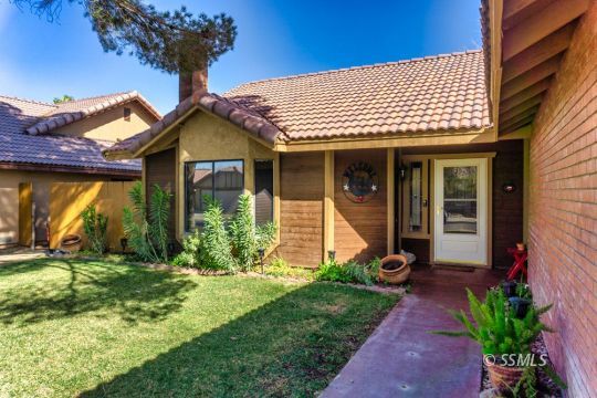 1236 Mountain View Drive Ridgecrest, CA 93555 - Photo 3 of 38 a view of a house with potted plants and a yard