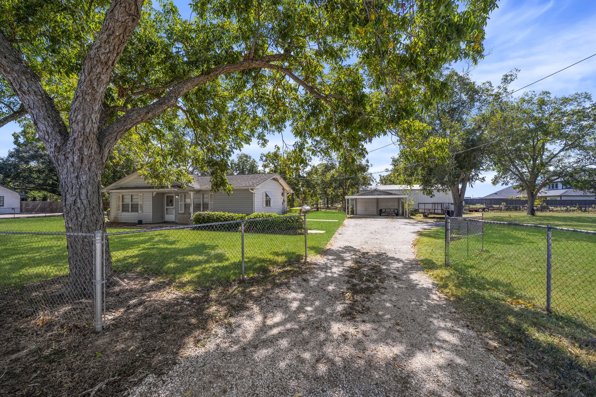 5418 Bryan Road Rosenberg, TX 77469 - Photo 16 of 49 a view of a house with backyard and a tree