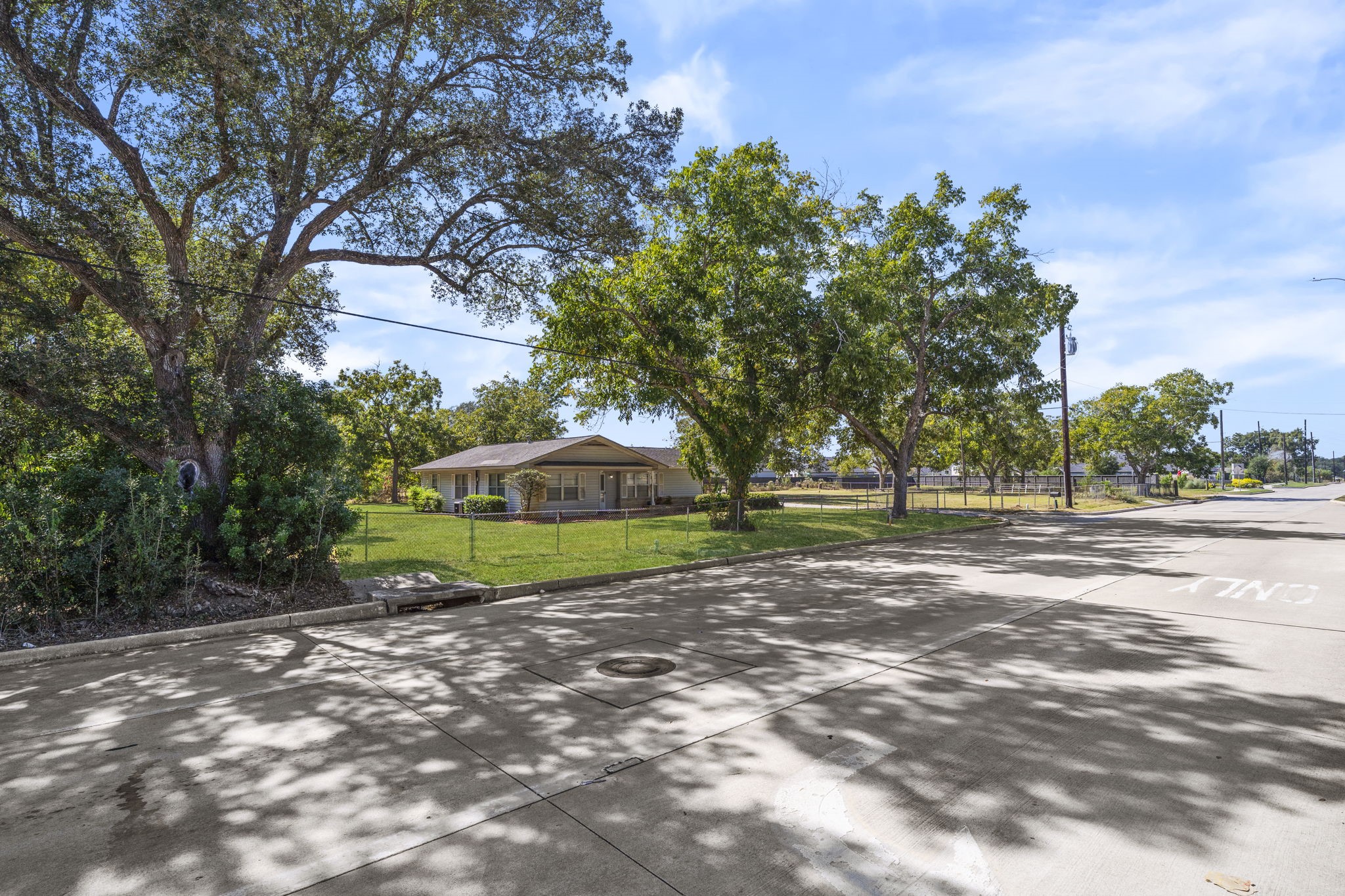 5418 Bryan Road Rosenberg, TX 77469 - Photo 17 of 49 a view of a backyard with large trees
