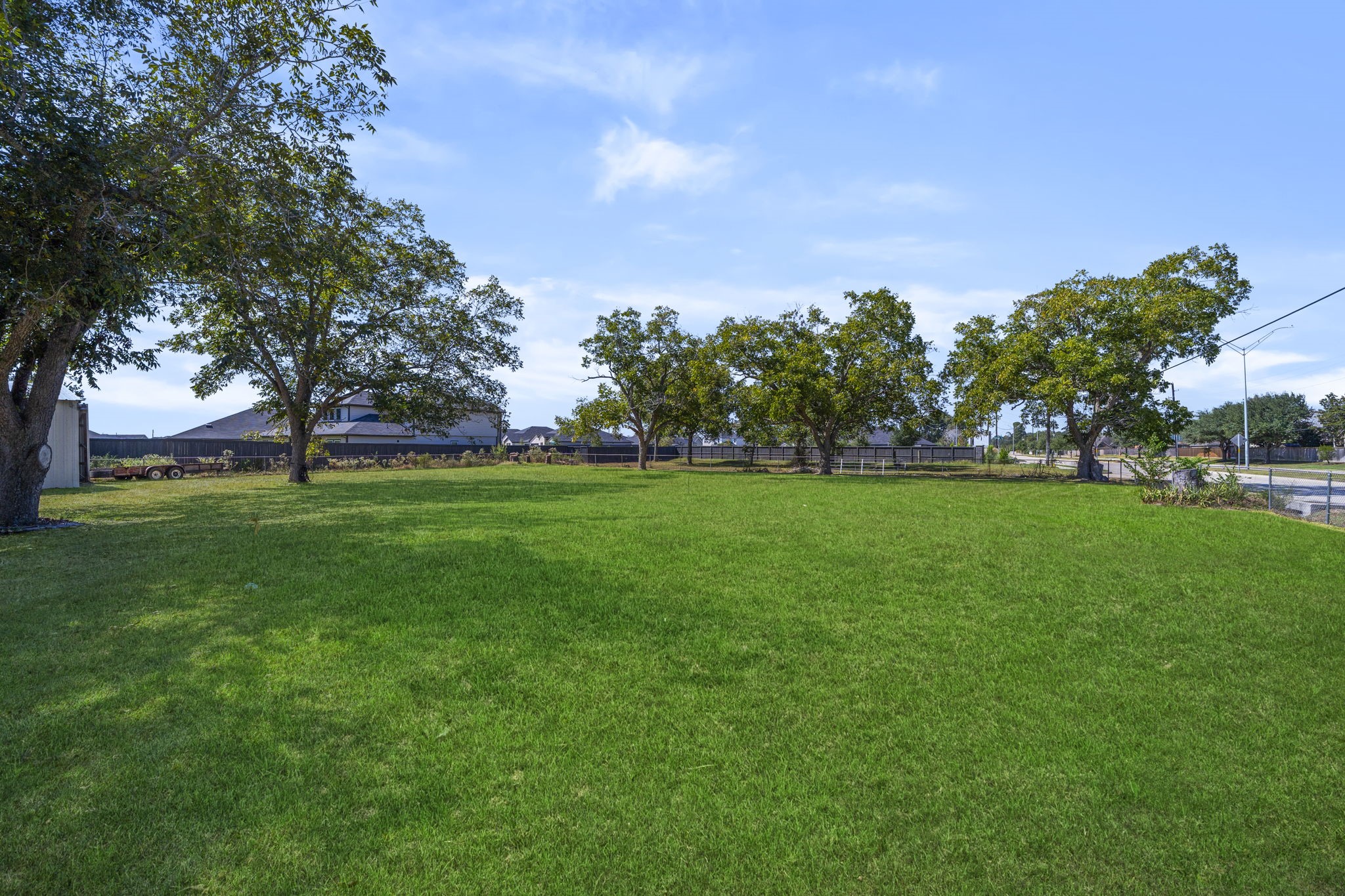 5418 Bryan Road Rosenberg, TX 77469 - Photo 33 of 49 a view of yard with grass & palm trees