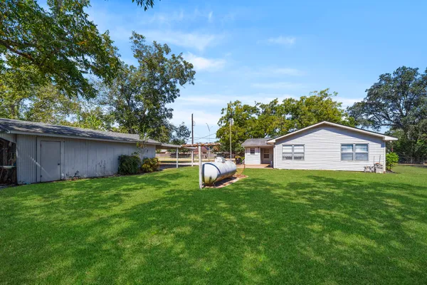 a view of a yard with an outdoor space